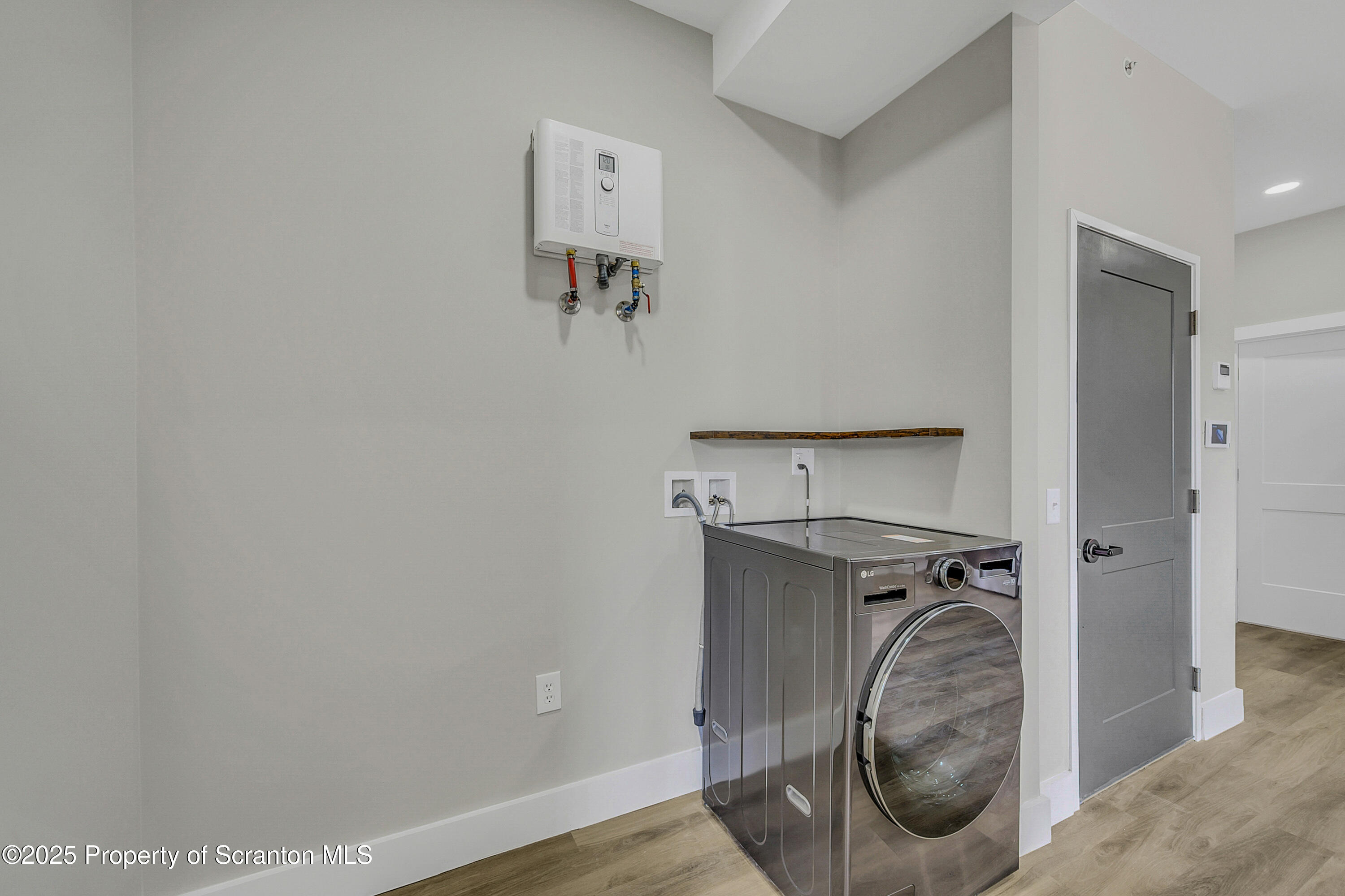 215 Hickory Street, Unit 11 Scranton, PA 18505 - Photo 9 of 13 a view of walk in closet with clothes and shoes