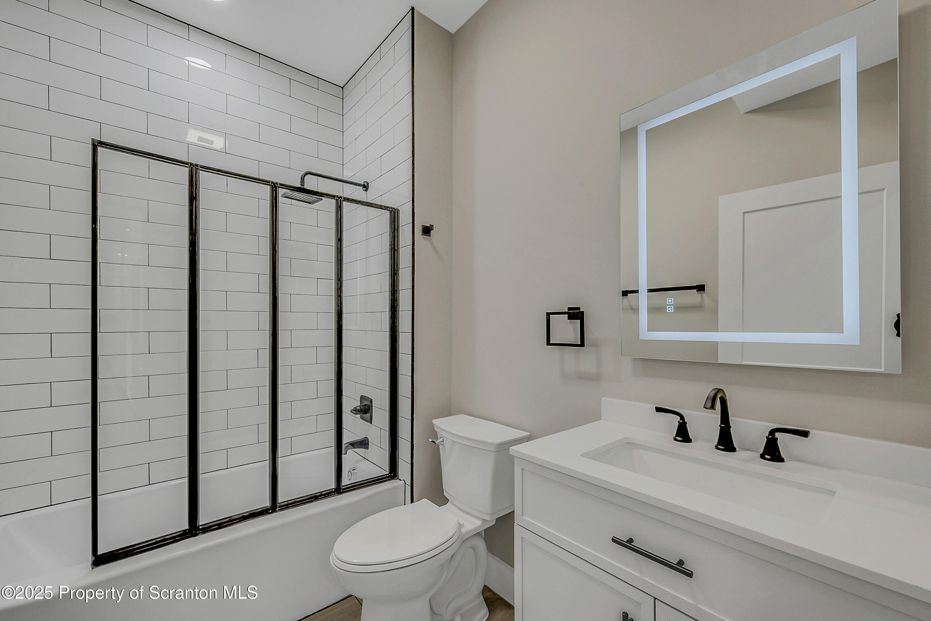 215 Hickory Street, Unit 11 Scranton, PA 18505 - Photo 10 of 13 a bathroom with a sink a toilet and shower