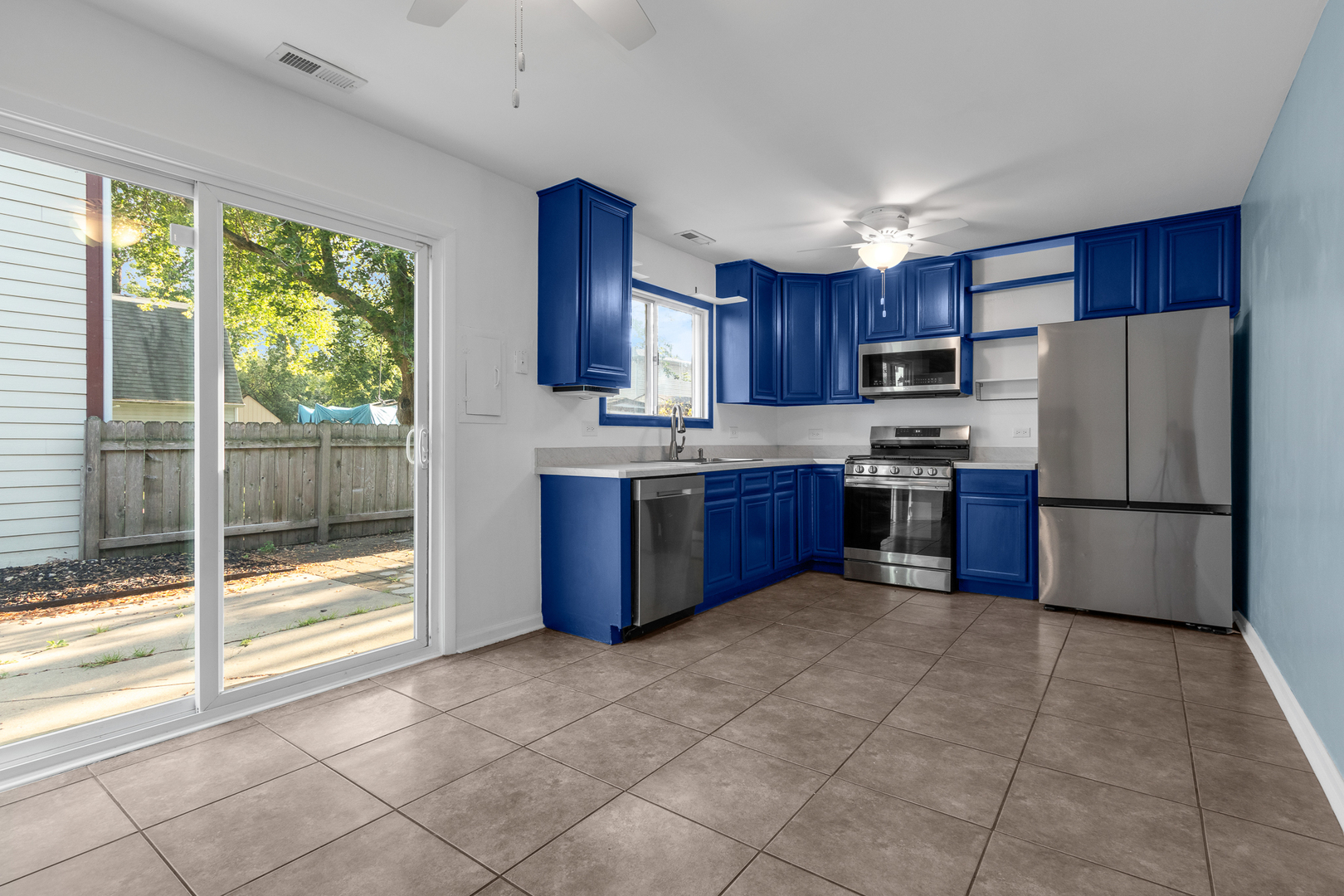 614 Kamiah Court Carol Stream, IL 60188 - Photo 11 of 30 a kitchen with stainless steel appliances granite countertop a refrigerator sink and cabinets