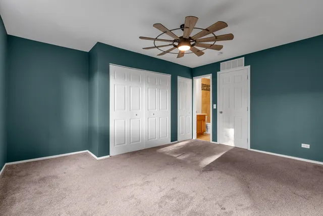 a view of a chandelier fan in a room