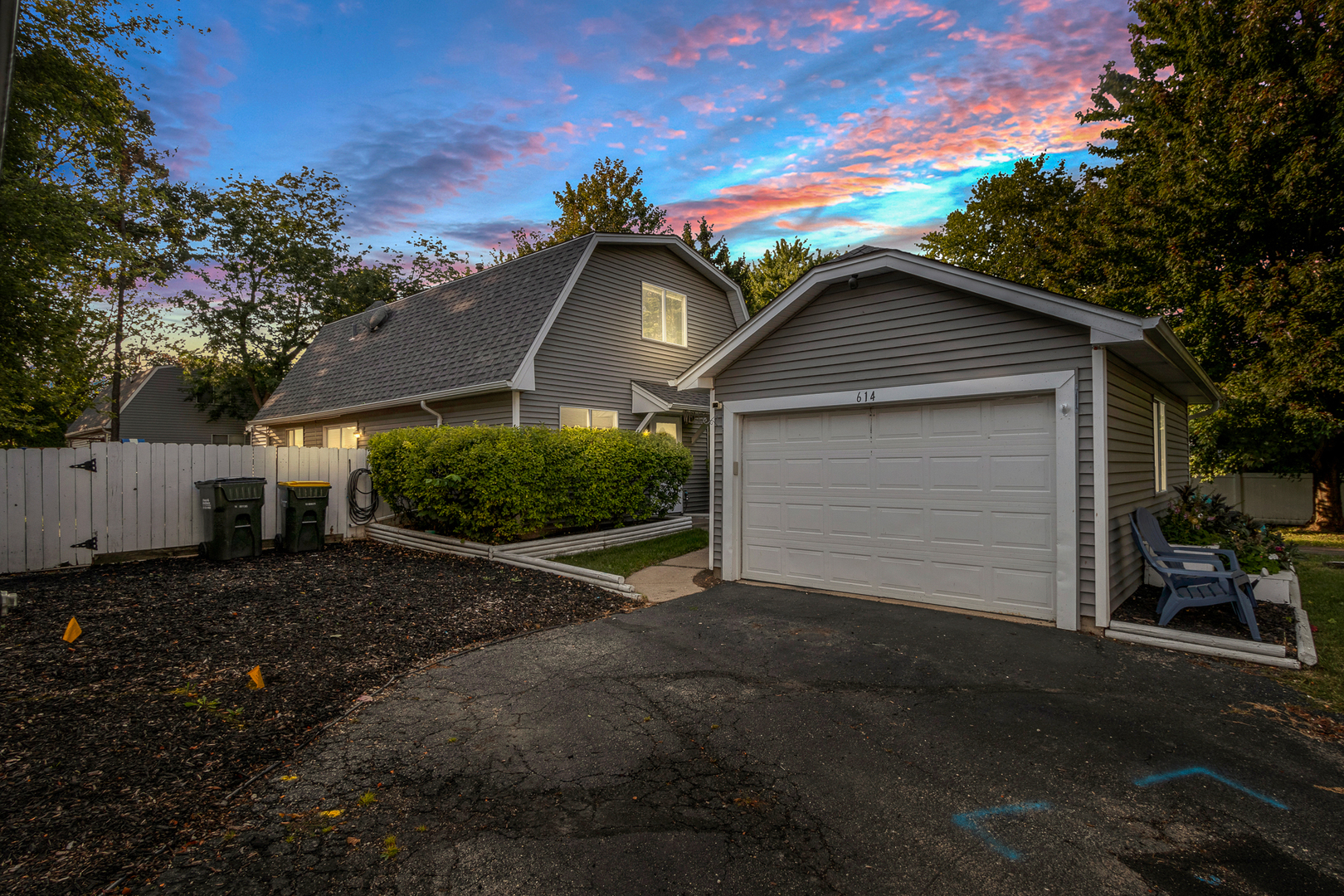 614 Kamiah Court Carol Stream, IL 60188 - Photo 2 of 30 a front view of a house with a yard and garage