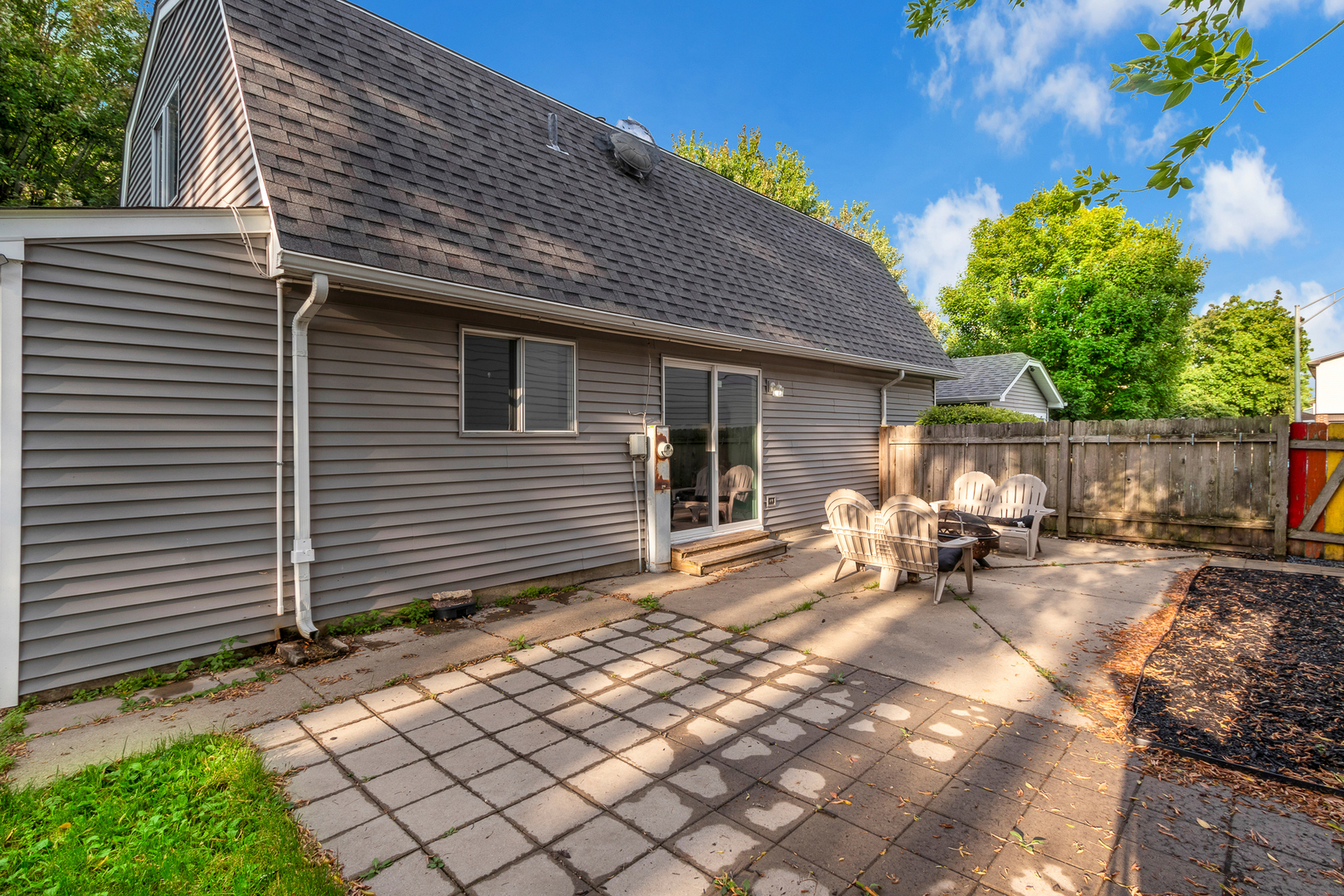 614 Kamiah Court Carol Stream, IL 60188 - Photo 23 of 30 a backyard of a house with table and chairs