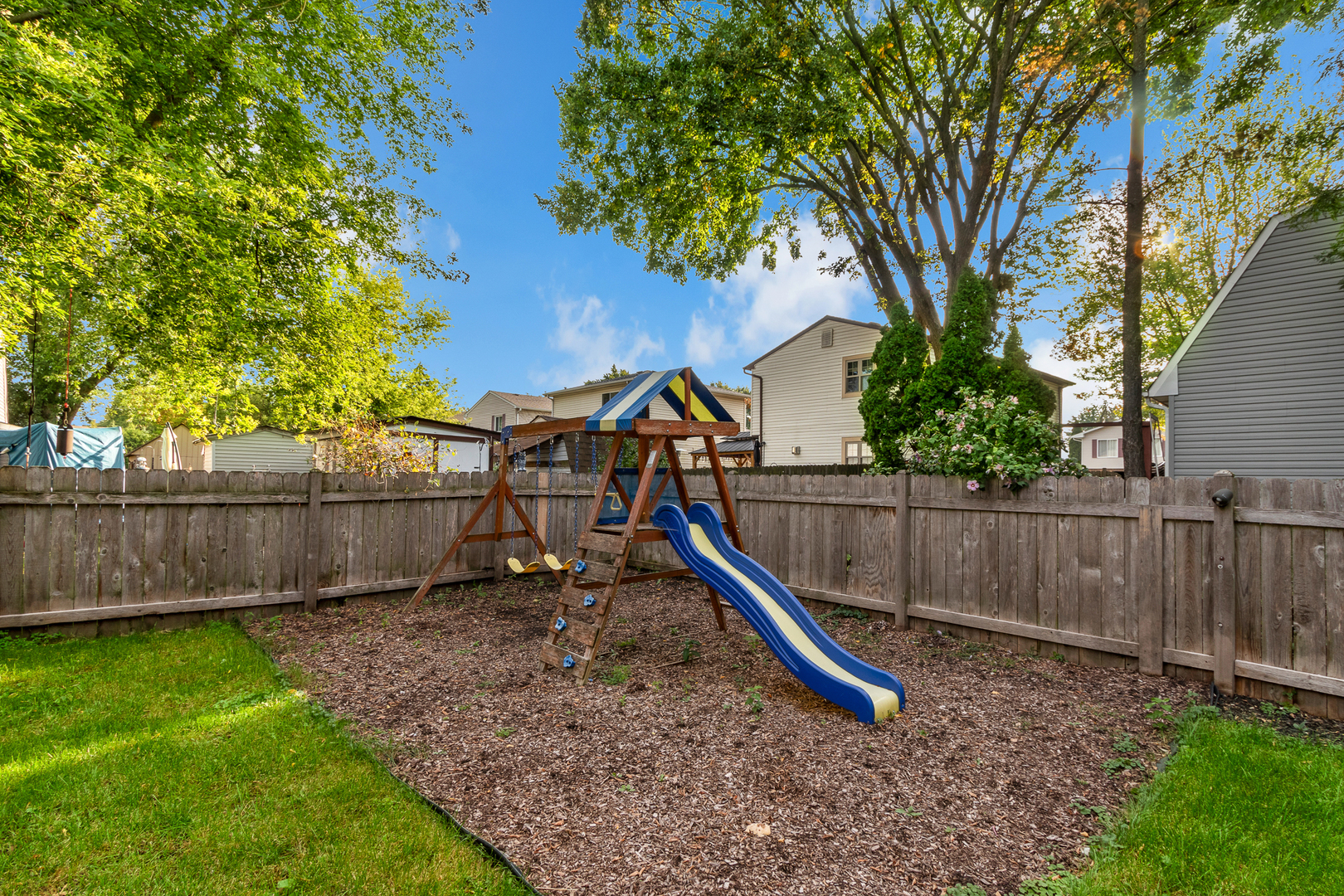 614 Kamiah Court Carol Stream, IL 60188 - Photo 24 of 30 a view of a backyard with swings