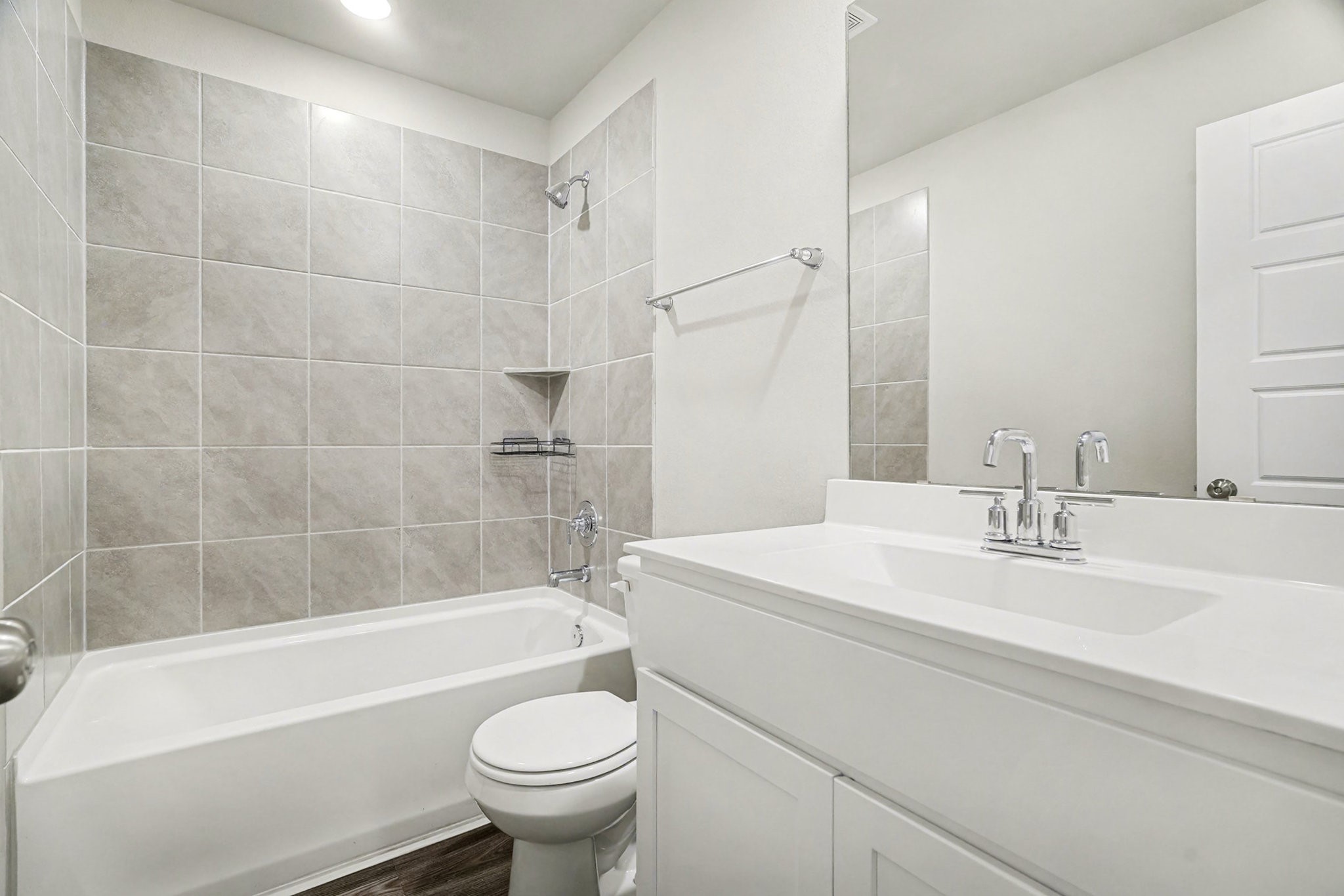 8427 Blue Shell Lane Cypress, TX 77433 - Photo 15 of 27 Secondary bathroom off the secondary bedrooms with a combination tub and shower.