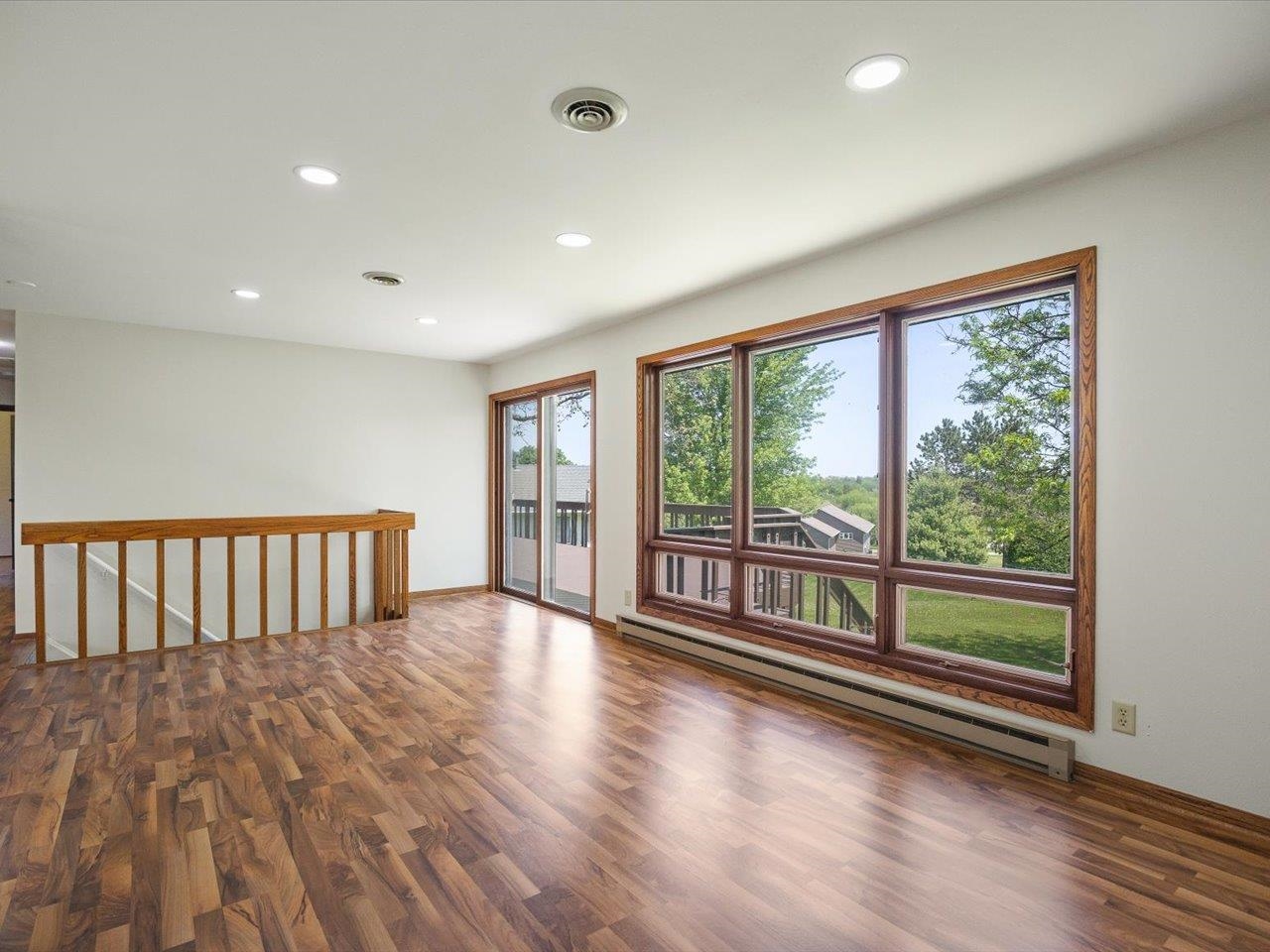 136 Lake Summerset Road Lake Summerset, IL 61019 - Photo 10 of 47 a view of an empty room with wooden floor and a window