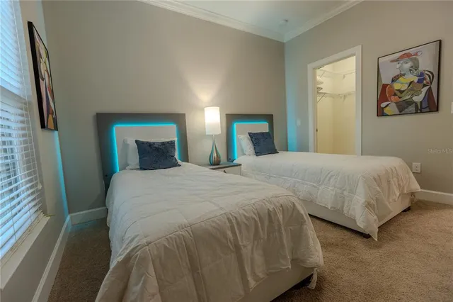 a bedroom with double bed and a large mirror