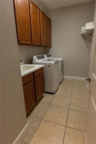 a utility room with washer and dryer