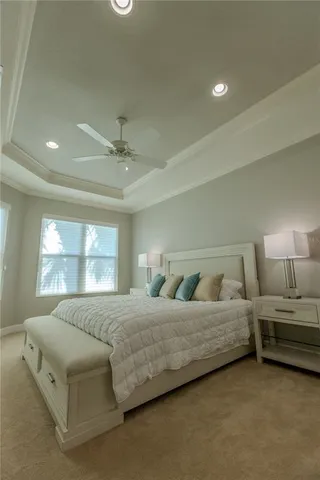 a bedroom with bed and window