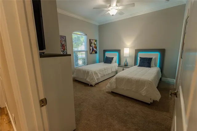 a bedroom with a bed and a chandelier