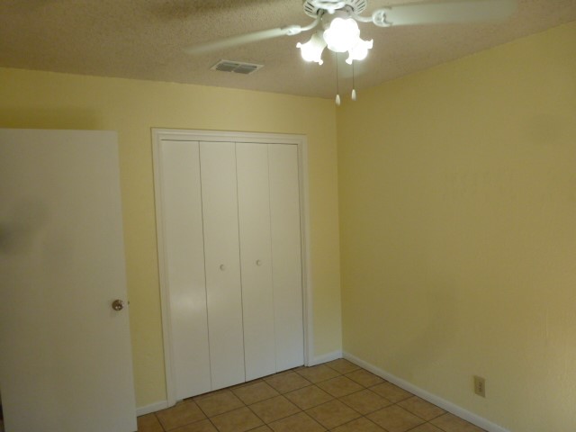 5006 Sara Drive, Unit A Austin, TX 78721 - Photo 7 of 10 a view of a hallway with a chandelier fan