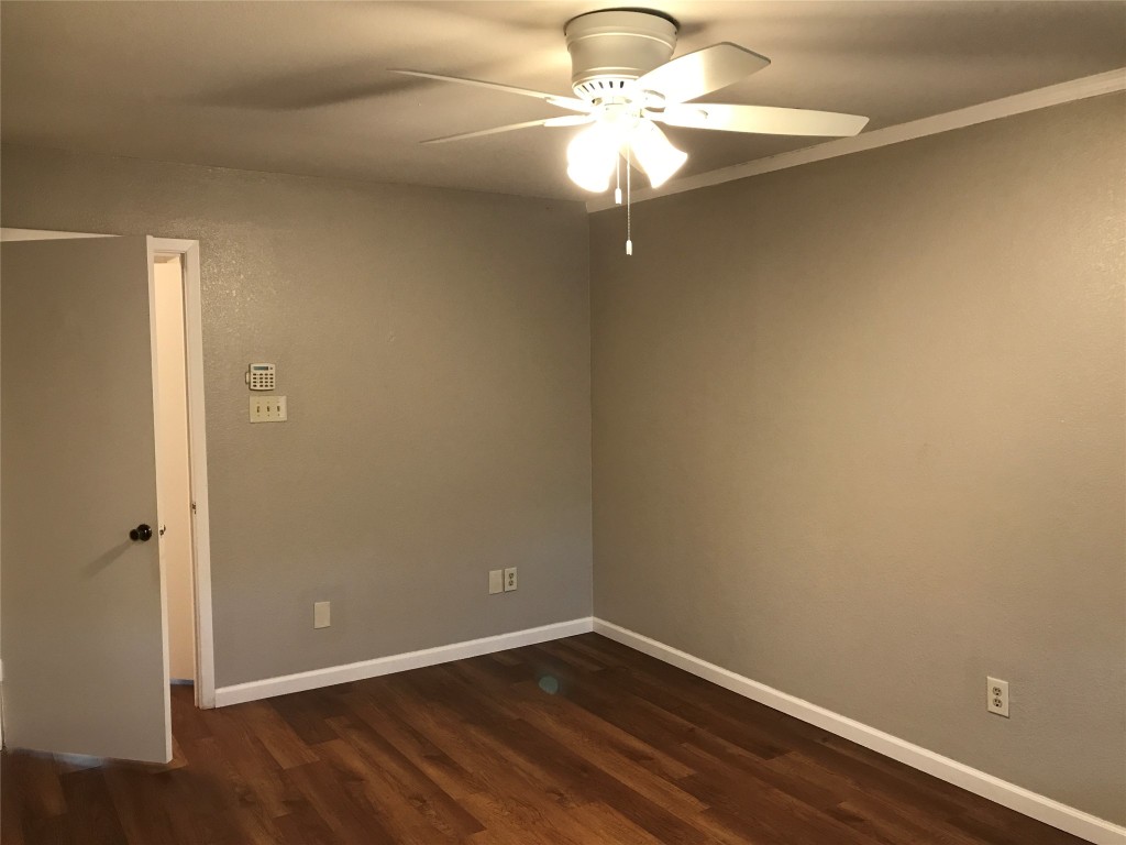 1015 East Yager Lane, Unit 87 Austin, TX 78753 - Photo 13 of 22 an empty room with a chandelier fan