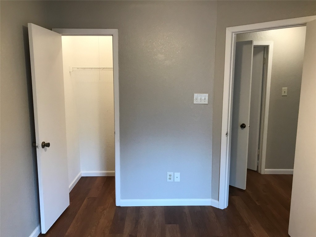 1015 East Yager Lane, Unit 87 Austin, TX 78753 - Photo 16 of 22 an empty room with wooden floor and closet