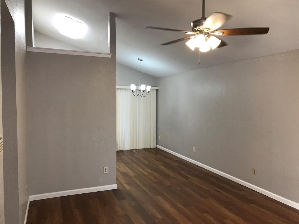 1015 East Yager Lane, Unit 87 Austin, TX 78753 - Photo 2 of 22 en empty room with wooden floor and chandelier fan