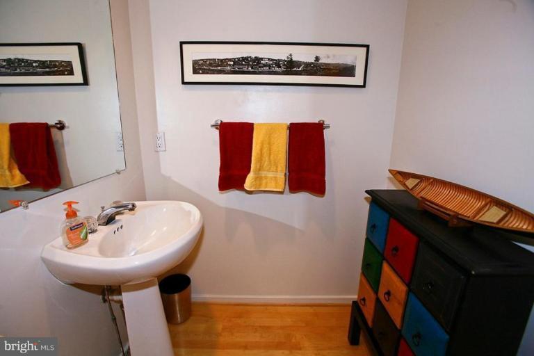 11584 Greenwich Point Road Reston, VA 20194 - Photo 17 of 23 a bathroom with a sink and a mirror