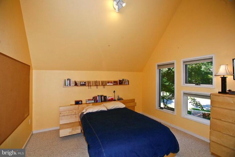 11584 Greenwich Point Road Reston, VA 20194 - Photo 4 of 23 a bedroom with a bed and a window