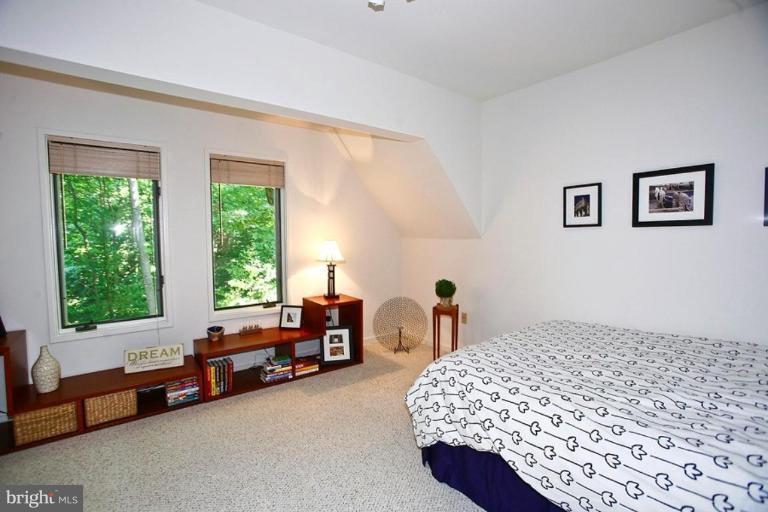 11584 Greenwich Point Road Reston, VA 20194 - Photo 9 of 23 a bedroom with a bed and a couch