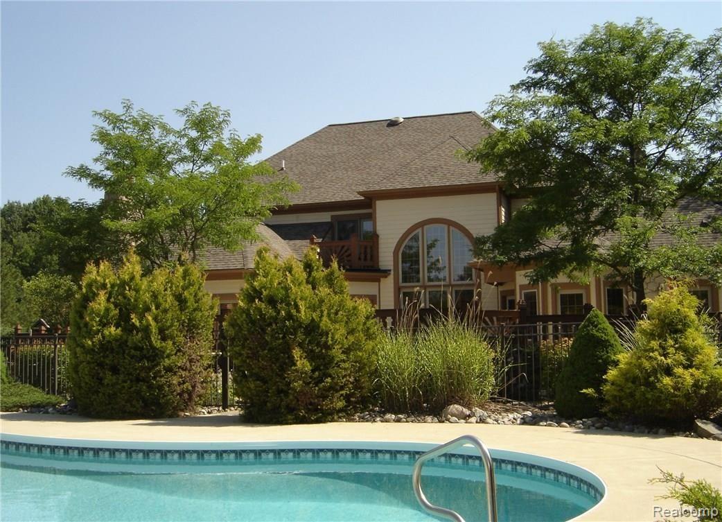 2829 Six Mile Road South Lyon, MI 48178 - Photo 8 of 46 Beautiful landscaping in fenced pool area.