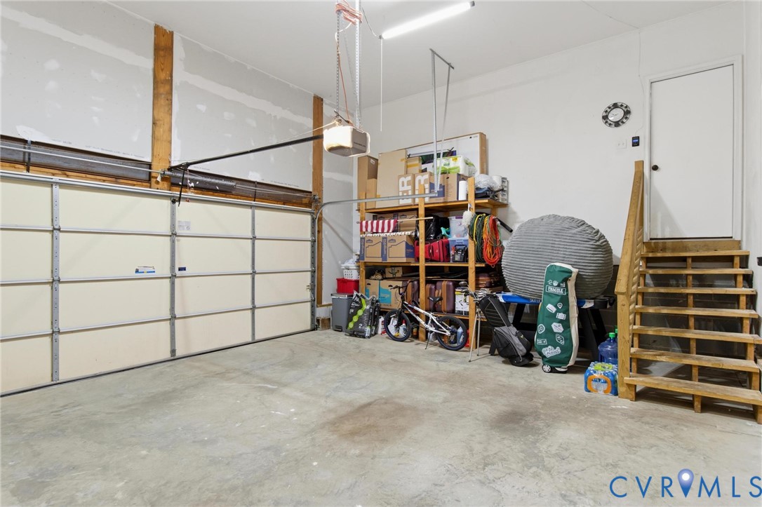 7807 Clover Ridge Place Chesterfield, VA 23832 - Photo 36 of 51 Two-car garage with concrete flooring, exposed woo