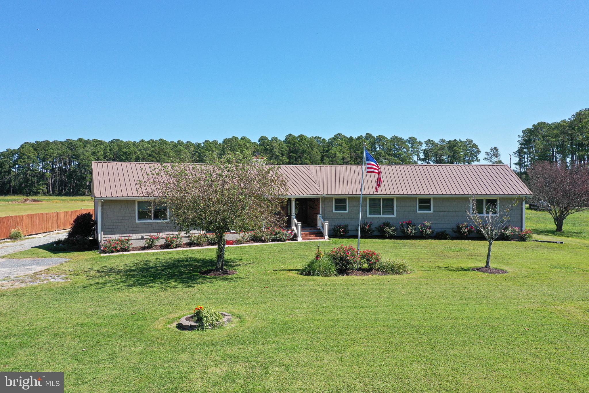 a view of a house with a backyard porch and sitting area