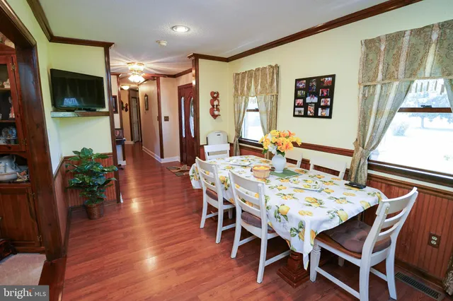 a kitchen with stainless steel appliances a refrigerator sink and microwave