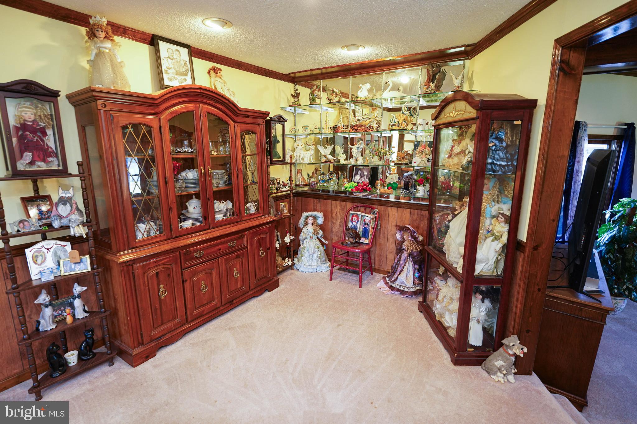 27949 Phoenix Church Road Marion Station, MD 21838 - Photo 15 of 82 Charming display of collectibles and dolls.