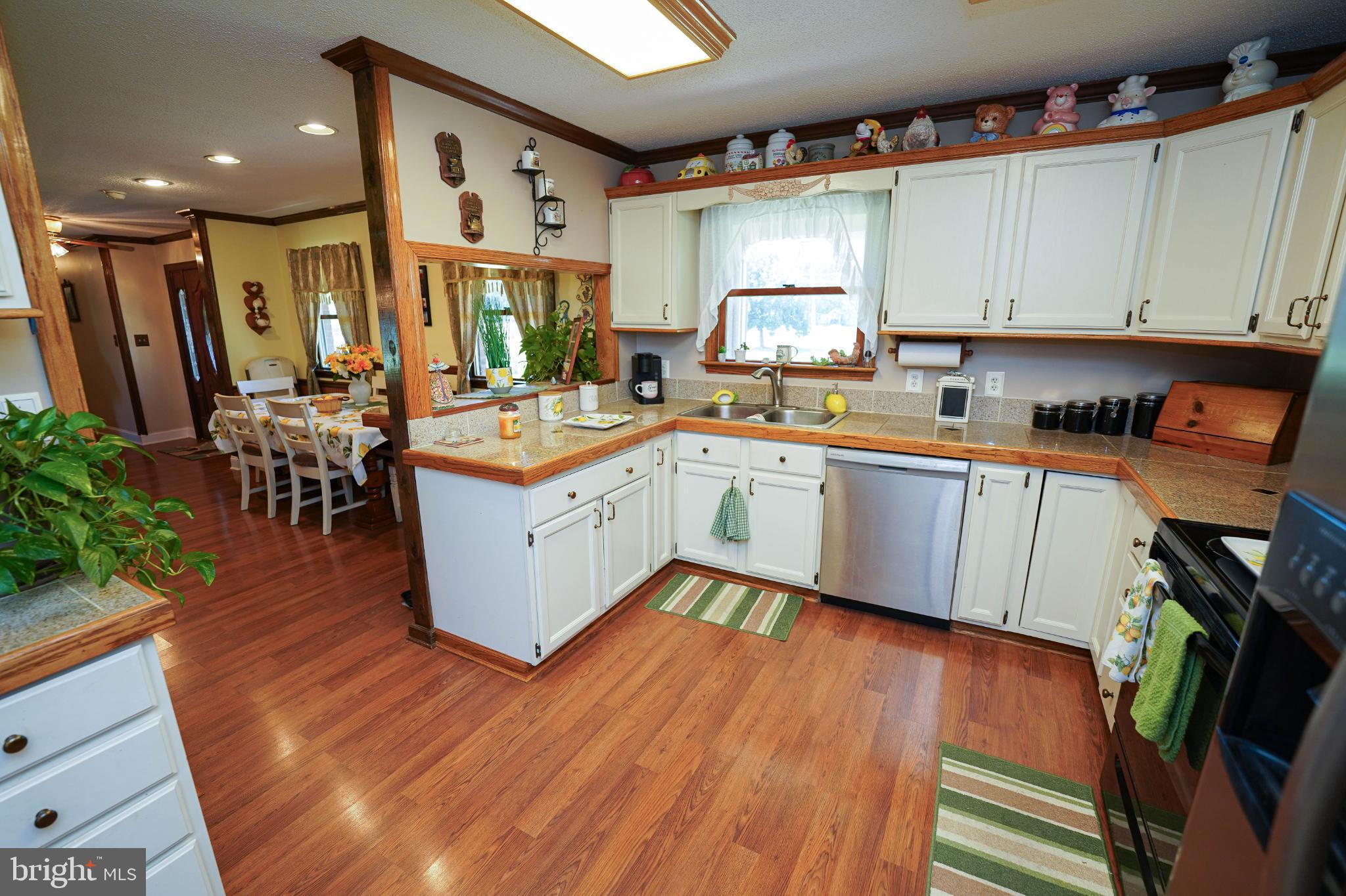27949 Phoenix Church Road Marion Station, MD 21838 - Photo 18 of 82 Charming kitchen with warm wooden accents.