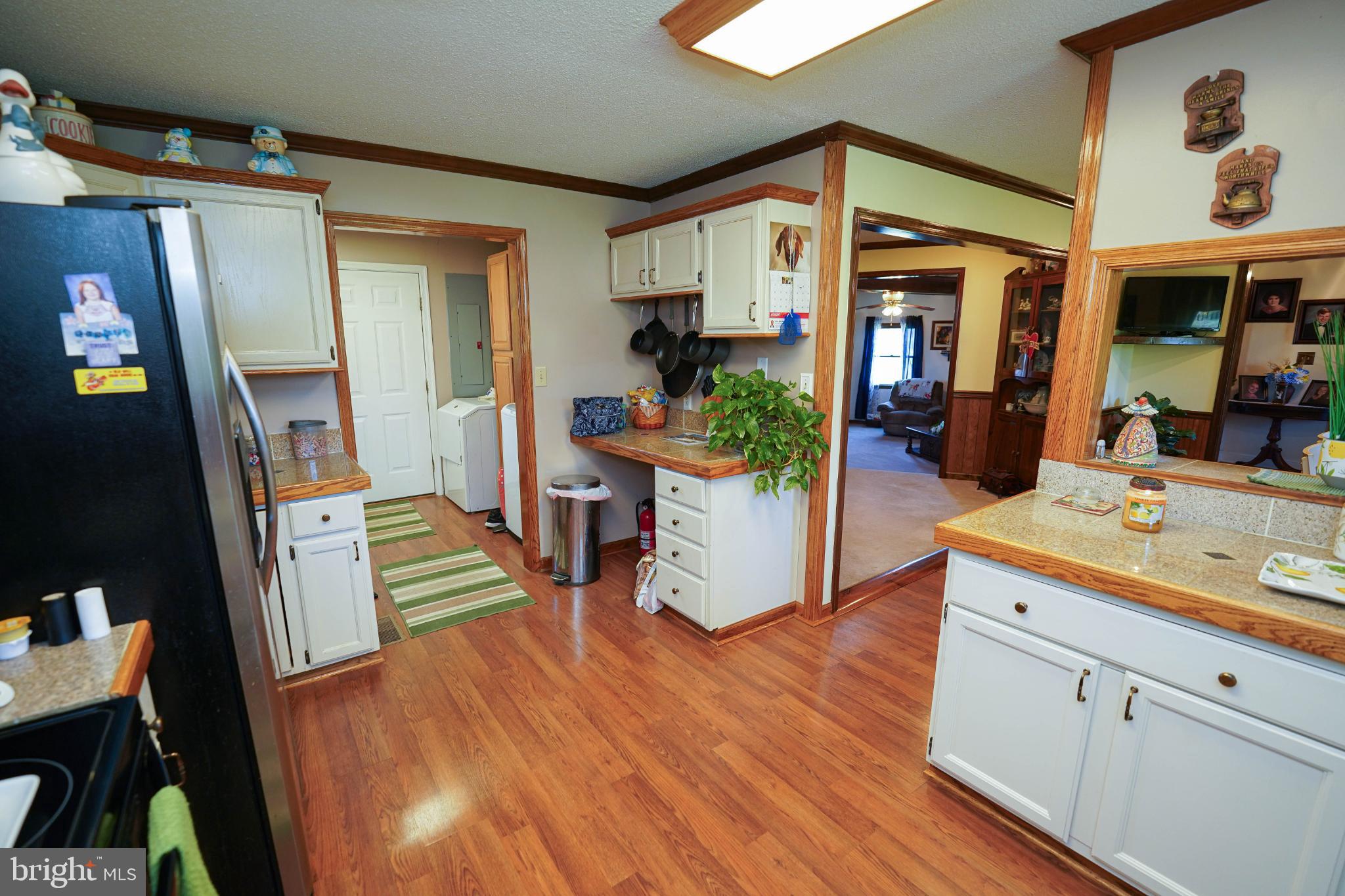 27949 Phoenix Church Road Marion Station, MD 21838 - Photo 19 of 82 a view of living room kitchen and hardwood floor