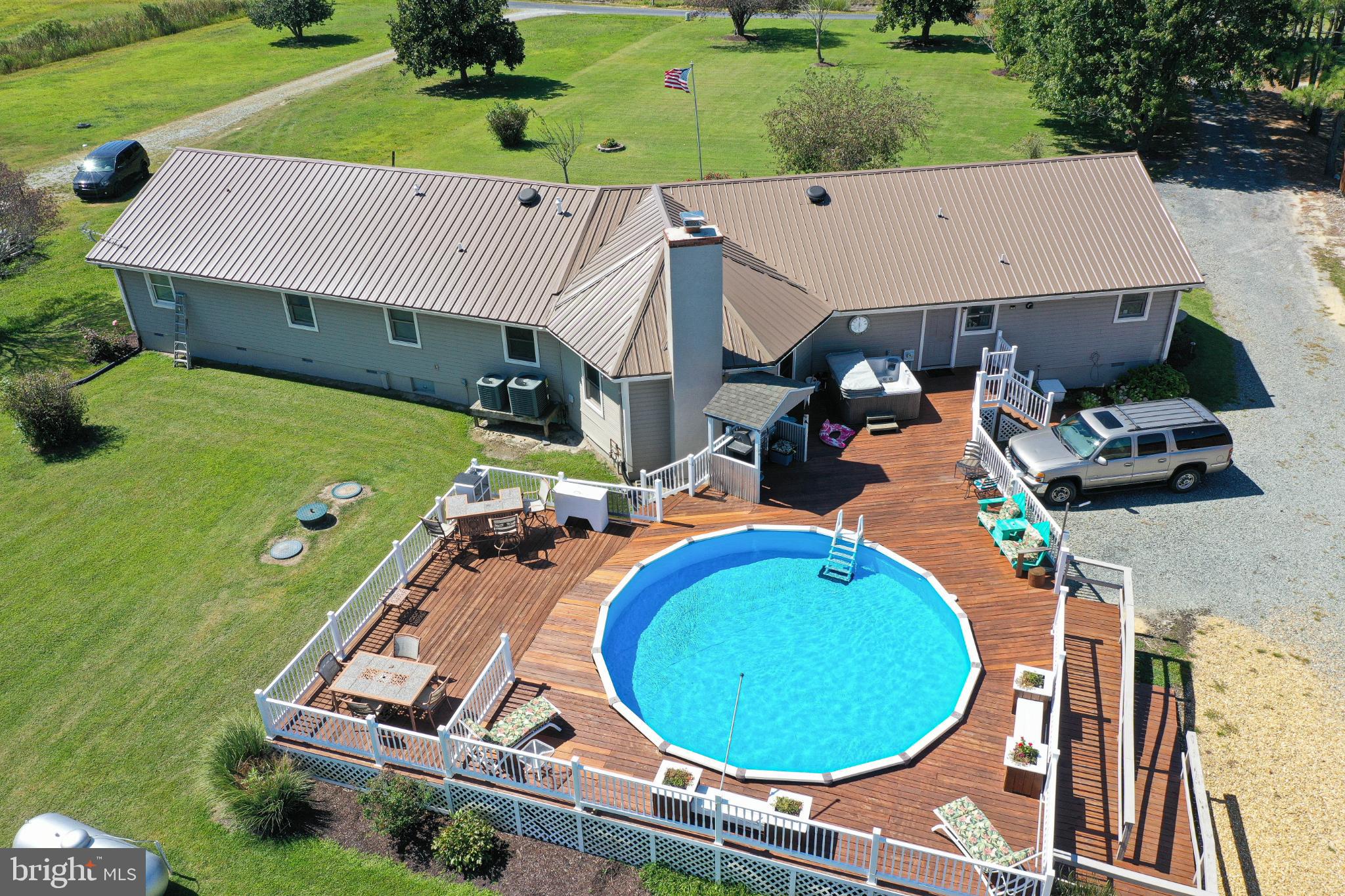 27949 Phoenix Church Road Marion Station, MD 21838 - Photo 2 of 82 an aerial view of a house with a garden and swimming pool