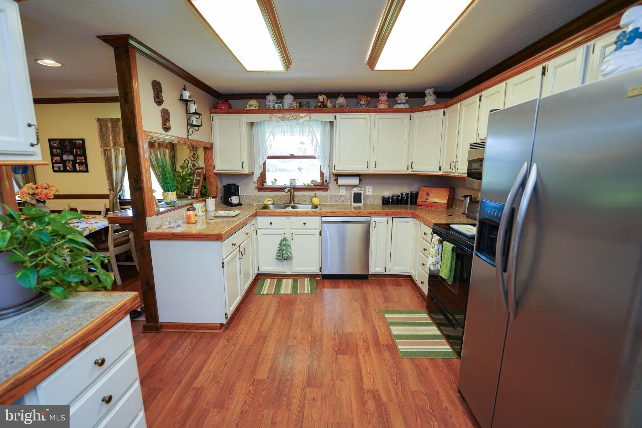 27949 Phoenix Church Road Marion Station, MD 21838 - Photo 21 of 82 Inviting kitchen with warm wooden accents.