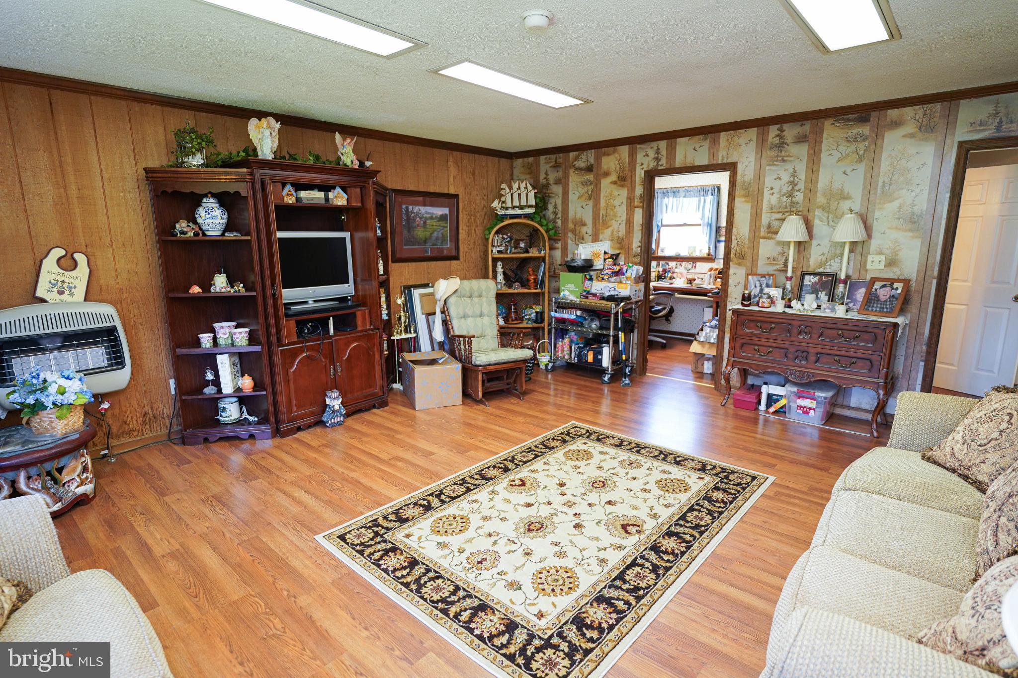 27949 Phoenix Church Road Marion Station, MD 21838 - Photo 29 of 82 a living room with furniture a rug and a large window