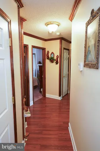a bathroom with a toilet a sink and a window