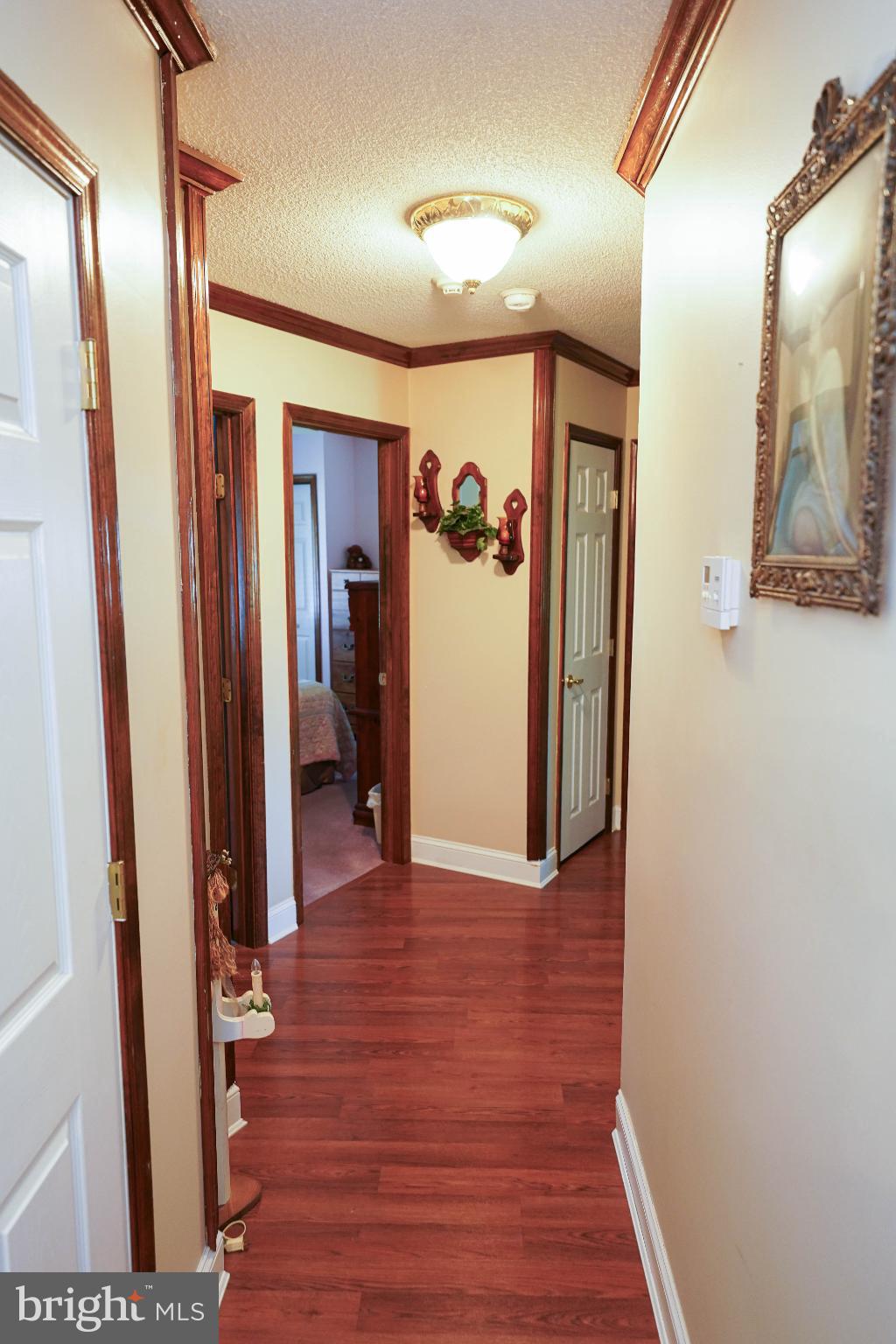 27949 Phoenix Church Road Marion Station, MD 21838 - Photo 33 of 82 a view of a hallway with wooden floor and closet