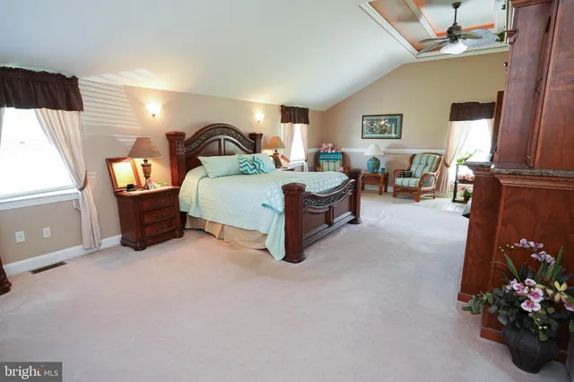 a bathroom with a double vanity sink mirror and a toilet