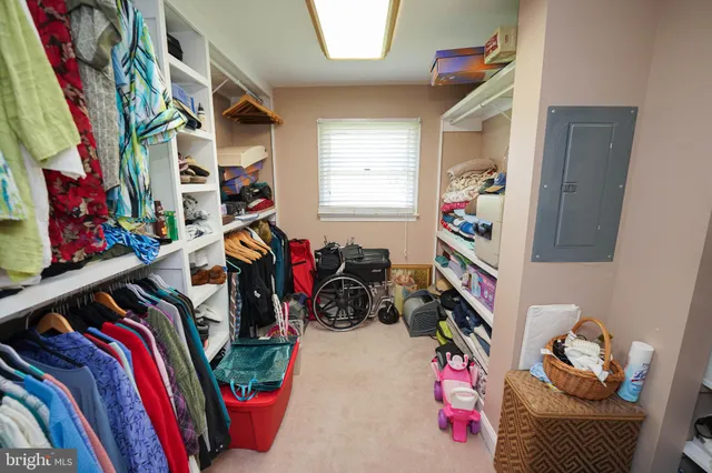 a bedroom with a bed and a mirror