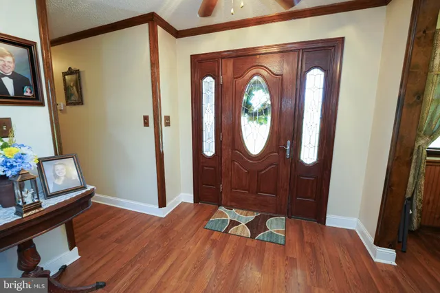 a view of a livingroom with furniture and wooden floor