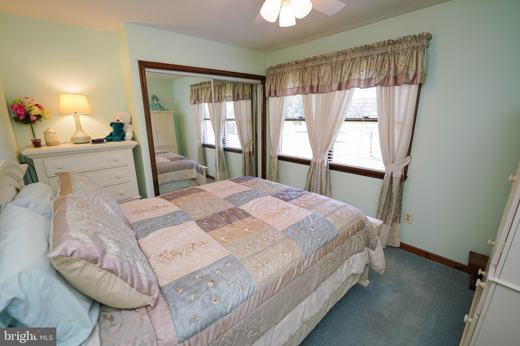 27949 Phoenix Church Road Marion Station, MD 21838 - Photo 47 of 82 Charming bedroom with soft pastel hues.