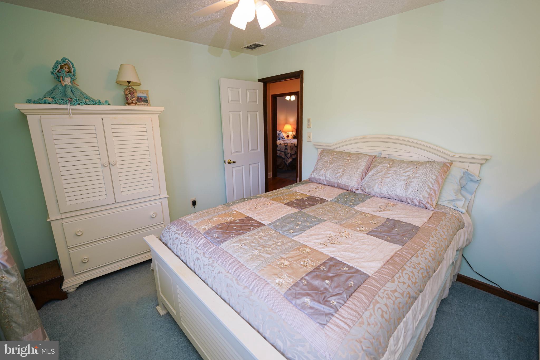 27949 Phoenix Church Road Marion Station, MD 21838 - Photo 49 of 82 a bedroom with a bed and a dresser