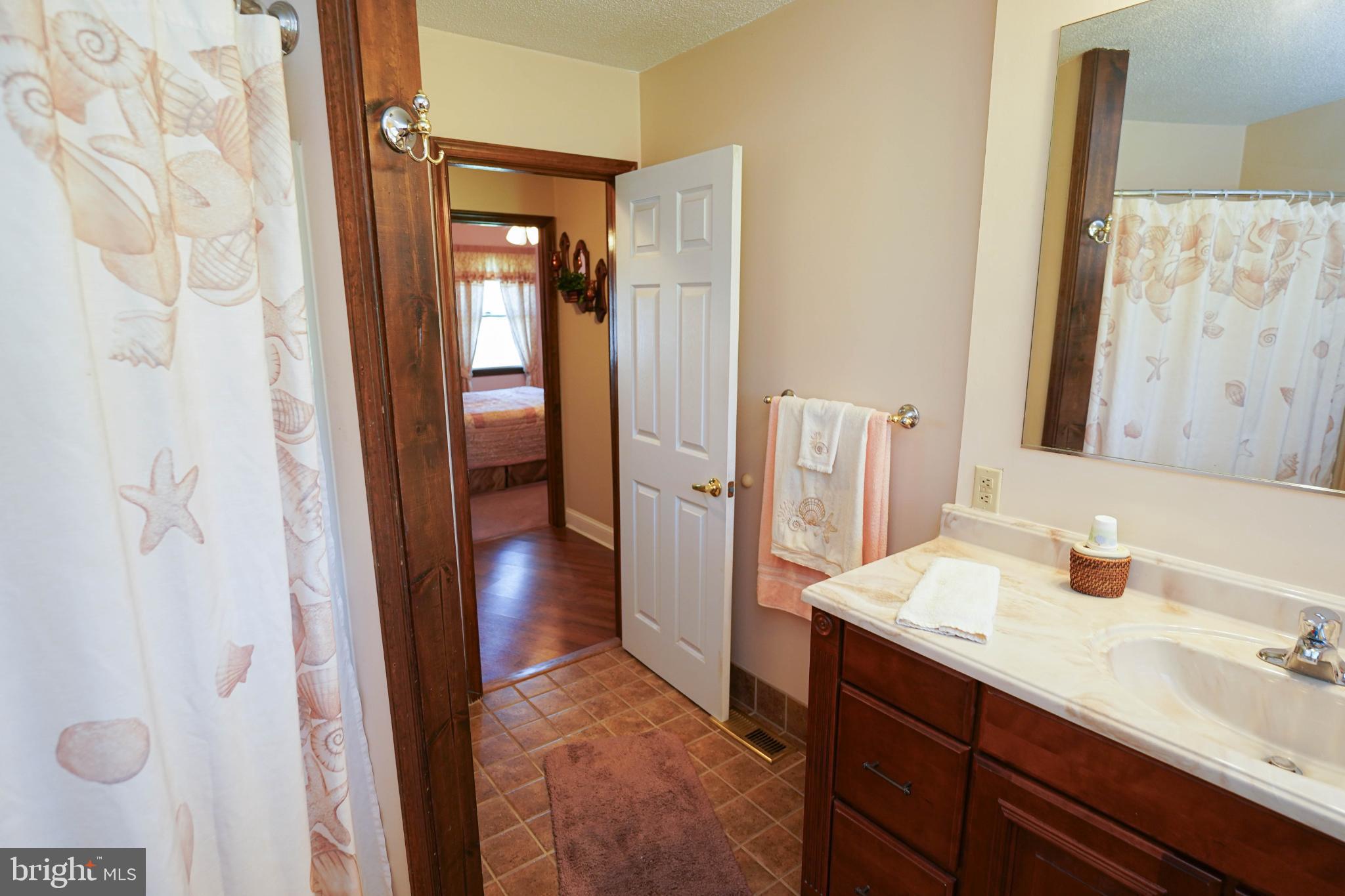 27949 Phoenix Church Road Marion Station, MD 21838 - Photo 54 of 82 Charming bathroom with inviting warmth.