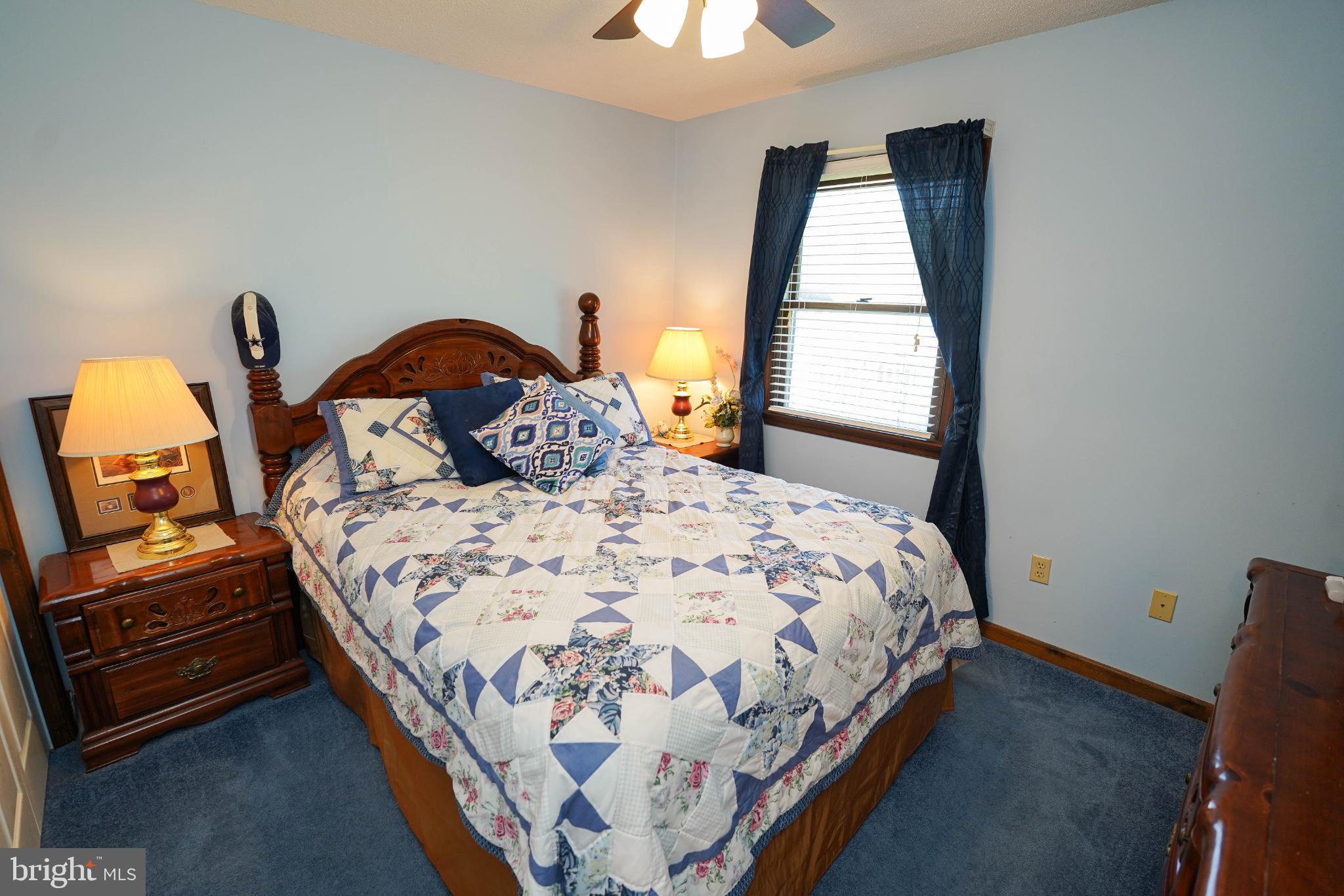 27949 Phoenix Church Road Marion Station, MD 21838 - Photo 55 of 82 a bedroom with a bed and a window