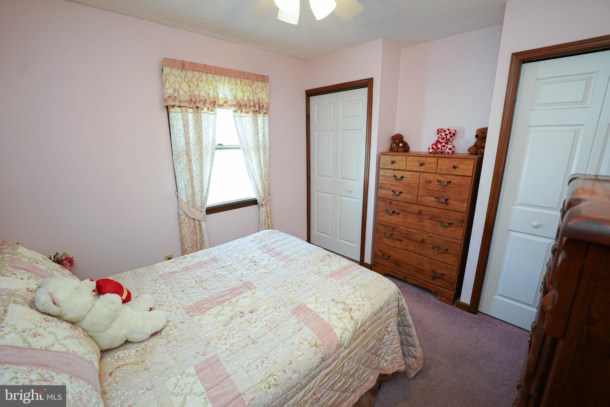 27949 Phoenix Church Road Marion Station, MD 21838 - Photo 59 of 82 a bedroom with a bed and a window