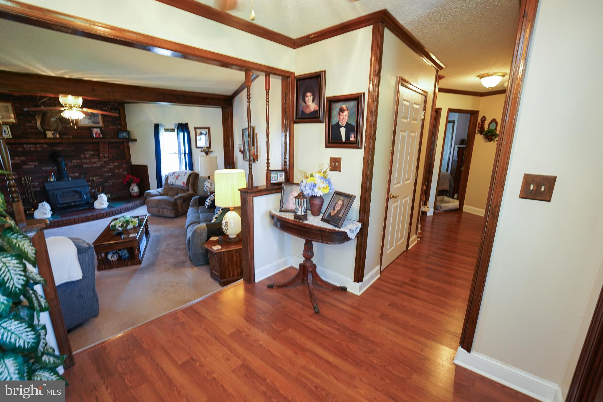 27949 Phoenix Church Road Marion Station, MD 21838 - Photo 6 of 82 a living room with furniture and a wooden floor