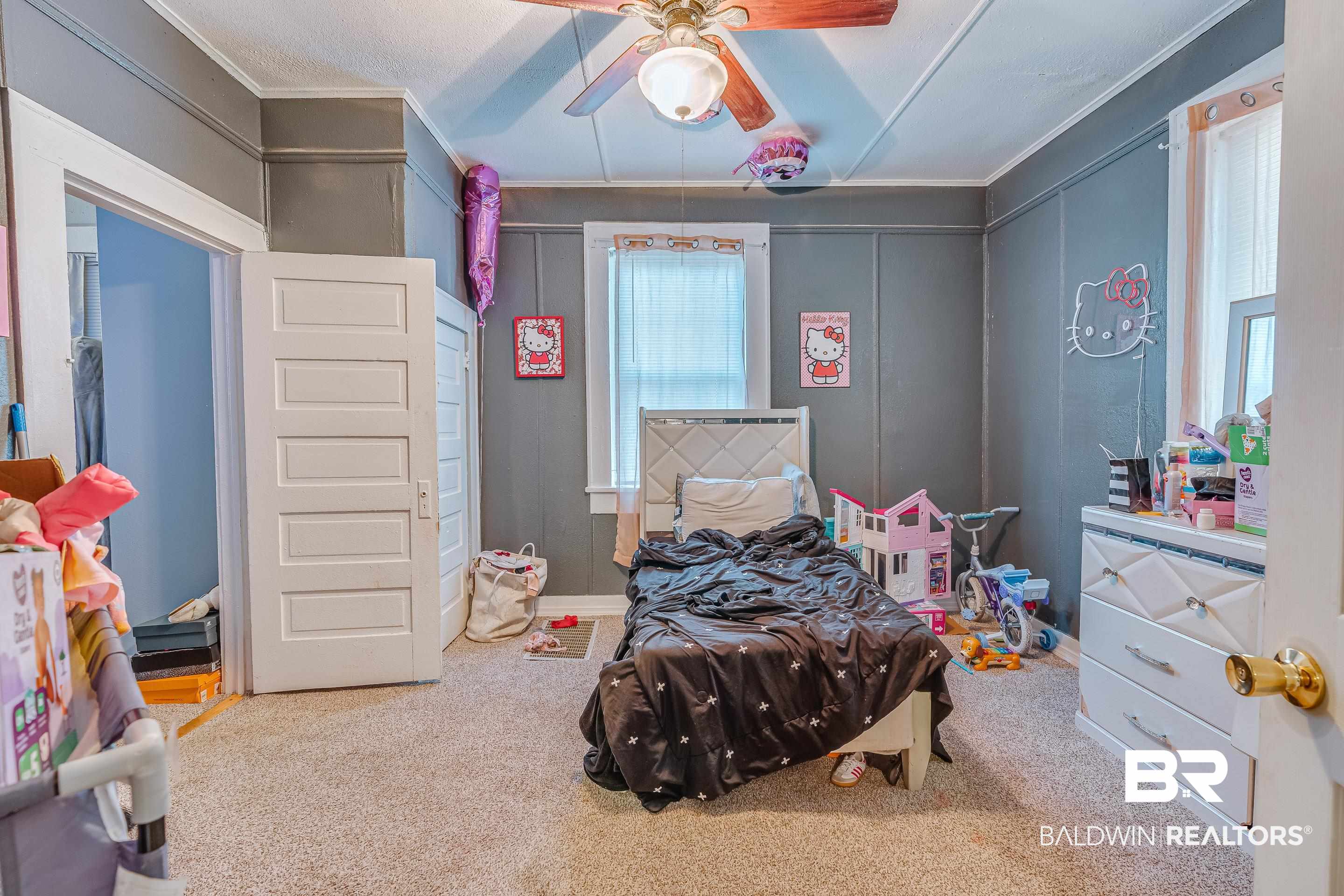 14 Southern Street Mobile, AL 36611 - Photo 12 of 26 Carpeted bedroom with ornamental molding and ceiling fan