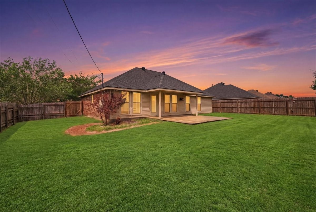 5585 Westchase Loop Lumberton, TX 77657 - Photo 13 of 13 a view of a house with a backyard