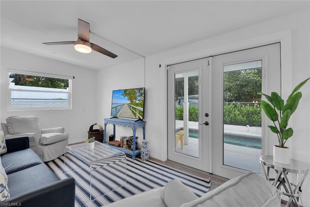 2048 Holiday Lane Naples, FL 34104 - Photo 11 of 28 a bedroom with furniture and a window