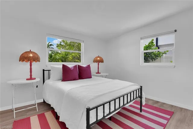 a bedroom with a bed and a table