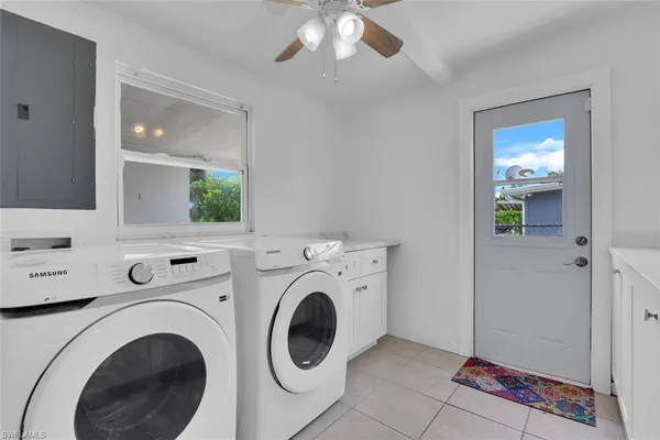 a view of livingroom with washer and dryer