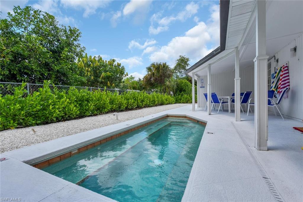 2048 Holiday Lane Naples, FL 34104 - Photo 26 of 28 a view of swimming pool with a patio