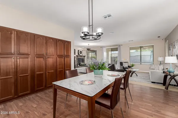 a view of a dining room with furniture window and wooden floor