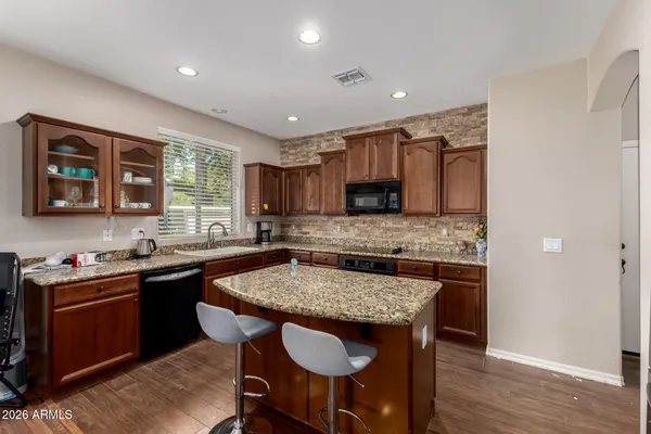 a kitchen with granite countertop a sink and counter space
