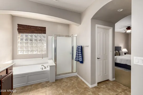 a bathroom with a bathtub and a shower